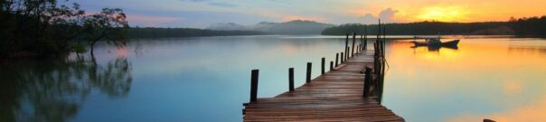 Sunrise over a lake and dock - mindful movement classes